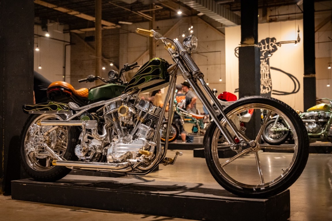 A striking custom chopper with gleaming chrome and intricate detailing, showcasing the artistry of bespoke motorcycle craftsmanship.